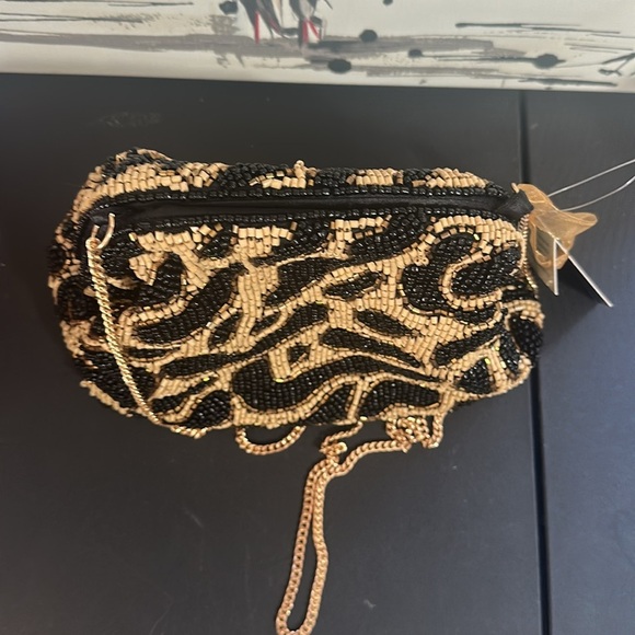 From India to you cheetah beaded clutch and gold crossbody chain bag